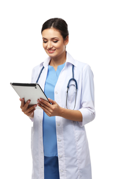 Smiling medical doctor holding a tablet - Foto, Imagen