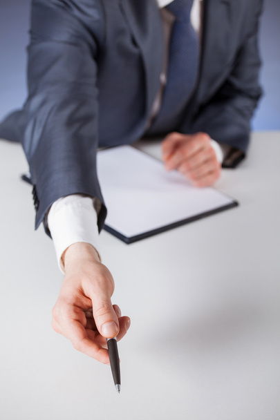 Businessman offering to sign a document - Foto, afbeelding