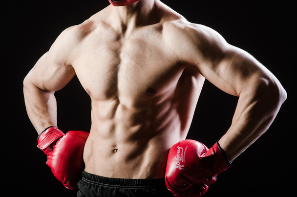 Muscular man in boxing concept - Фото, зображення