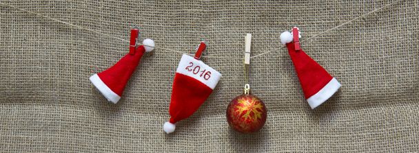 Christmas hats  and New Year  2016 background. - Photo, Image