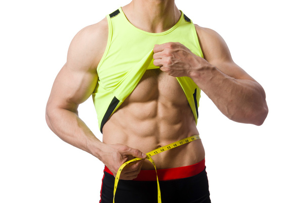 Muž měřící svaly na bílém pozadí - Fotografie, Obrázek