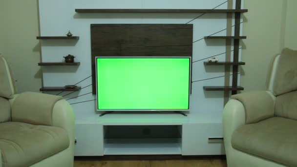 zielony ekran i telewizyjnego pilota zdalnego sterowania - Materiał filmowy, wideo