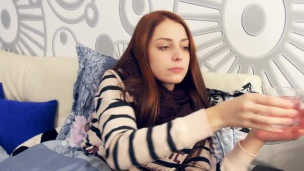 Ill woman in bed drink effervescent medicine - Felvétel, videó