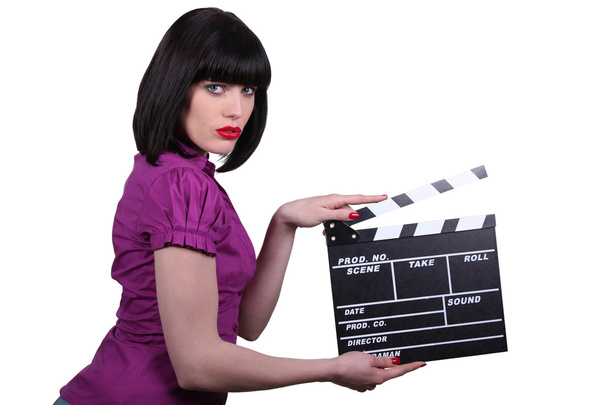Brunette woman with a cinema clap - Foto, Imagem