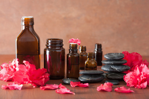 essential oil azalea flowers black massage stones - Photo, Image