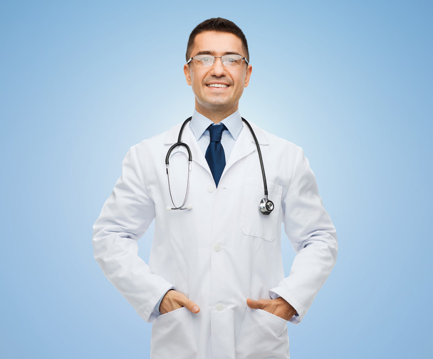 happy male doctor in white coat s with stethoscope - Foto, afbeelding