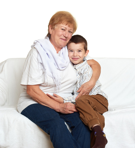 portrait of child boy and grandmother on white, happy family concept - Fotografie, Obrázek