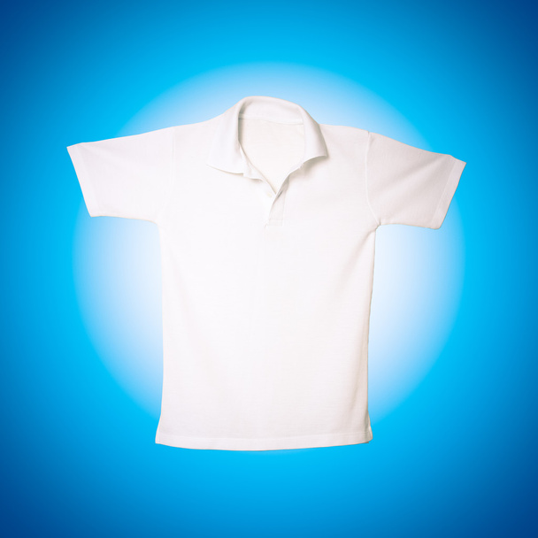 White polo shirt on blue background - Photo, Image