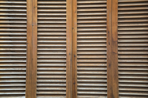 Brown, wooden, vertical completely covered blinds. - Photo, Image