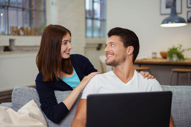 happy young couple with laptop at home - Photo, Image