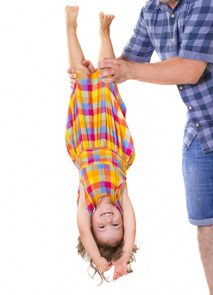 Happy little girl upside down - Photo, Image