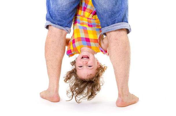 Happy little girl upside down - Фото, изображение