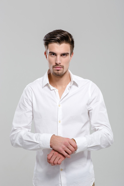 Portrait of handsome attractive man in white shirt - 写真・画像