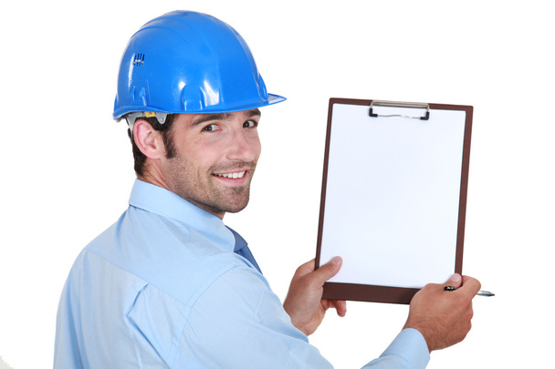 Architect holding clip-board and pen - Photo, image