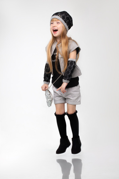 Beautiful little happy redhead girl model standing posing in studio white background. - Фото, зображення