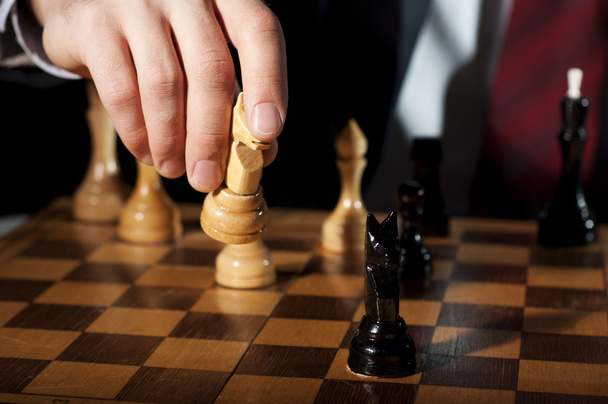 Businessman plays chess - Photo, Image