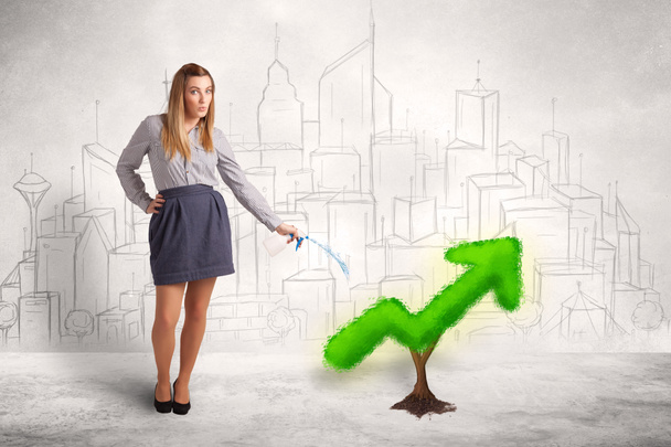 Mujer de negocios regar flecha de planta verde
 - Foto, Imagen