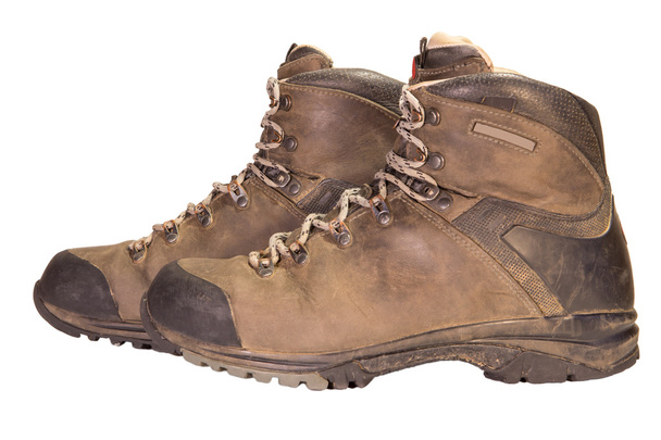 Tracking the old brown leather boots. - Photo, Image
