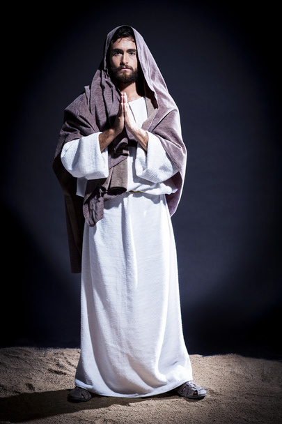 jesus praying on black background - Fotó, kép