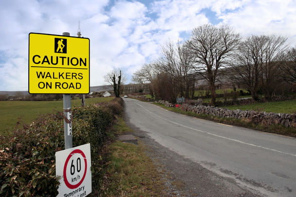 Caution walkers on road signs speed limit - Photo, Image