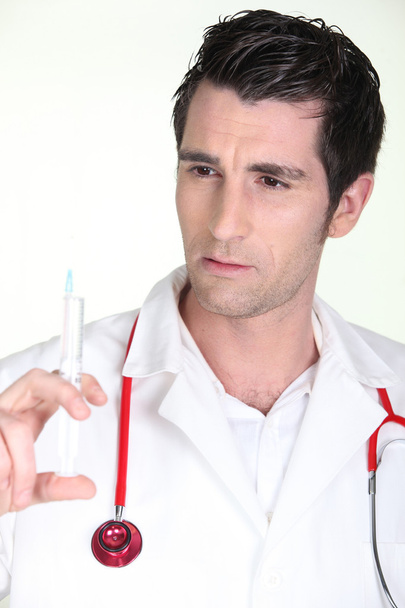 Man with syringe - Photo, image
