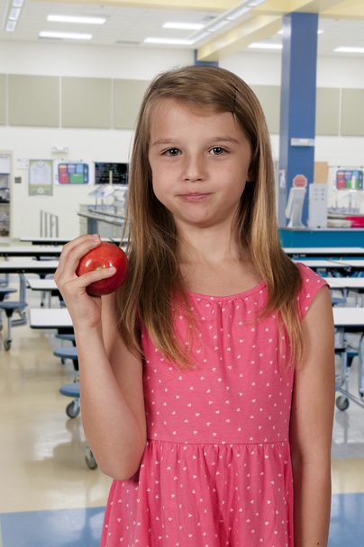 маленька дівчинка їсть яблуко
 - Фото, зображення
