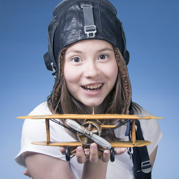 Cute young girl with airplane model - Foto, Imagem