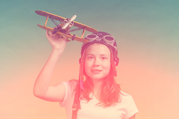 Cute girl playing with airplane model - Photo, Image