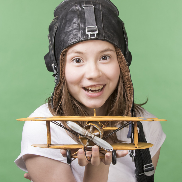 Cute young girl with airplane model - Foto, immagini