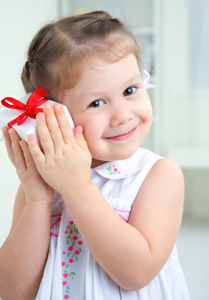 girl holding birthday gift box - Fotó, kép