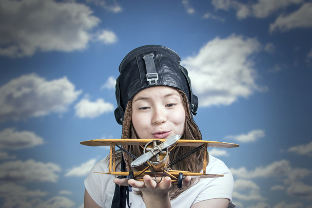 Cute young girl with airplane model - Fotografie, Obrázek