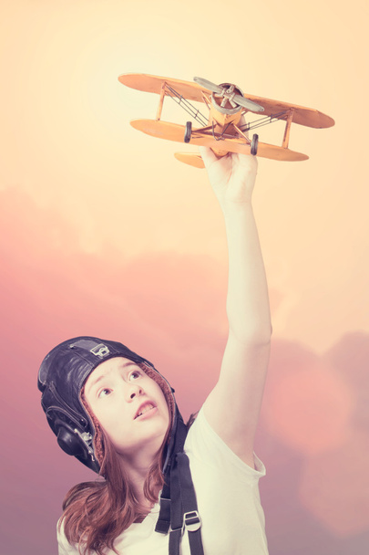 Cute young girl with airplane model - Fotoğraf, Görsel