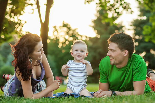 Young Attractive Parents and Child Portrait Outdoors - Φωτογραφία, εικόνα