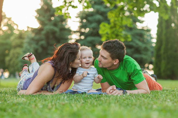 Young Attractive Parents and Child Portrait Outdoors - Foto, Imagen