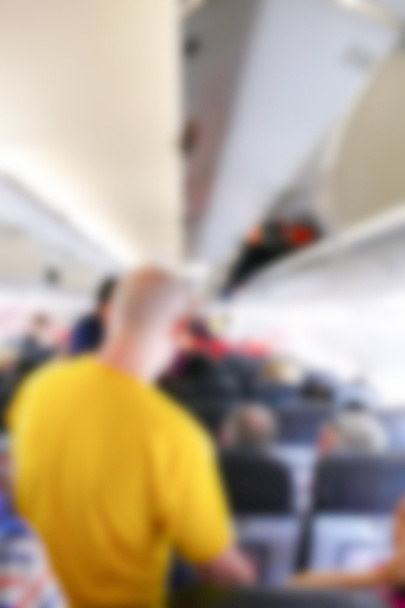 blurry defocused image of passenger in the airplane  - Photo, Image