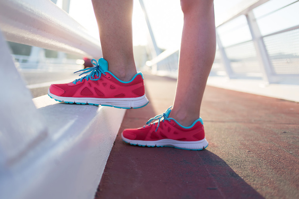 Woman's legs in running shoes - Фото, зображення