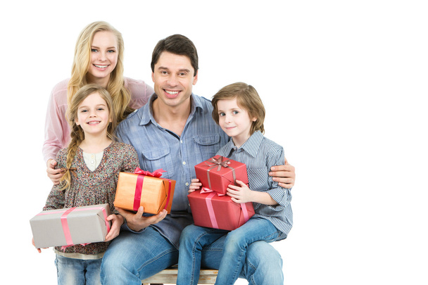 Happy family with gifts isolated. - Foto, afbeelding
