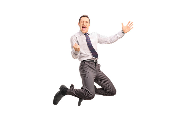 businessman jumping and gesturing success - Foto, afbeelding