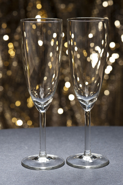 Champaign glass in front of glitter background - Fotoğraf, Görsel