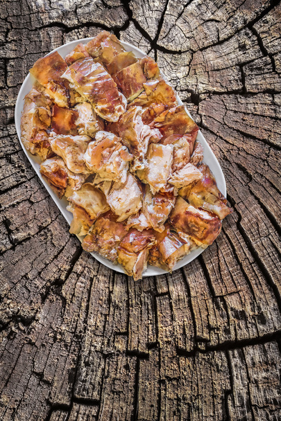 Plateful of Spit Roasted Pork Slices on Old Cracked Stump Surface - Photo, Image