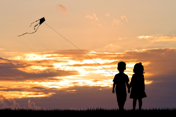 children with kite at sunset - Foto, imagen