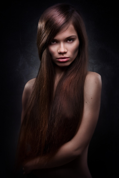 Attractive young woman with long hair - Fotoğraf, Görsel