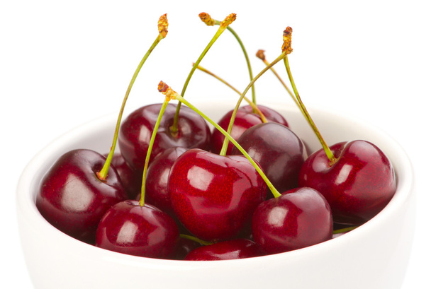 Red ripe cherries in a bowl on white background - Fotografie, Obrázek