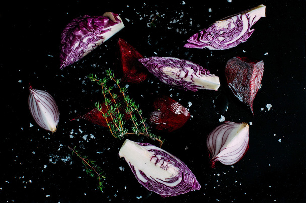 Purple vegetables on the dark surface - Foto, Imagem