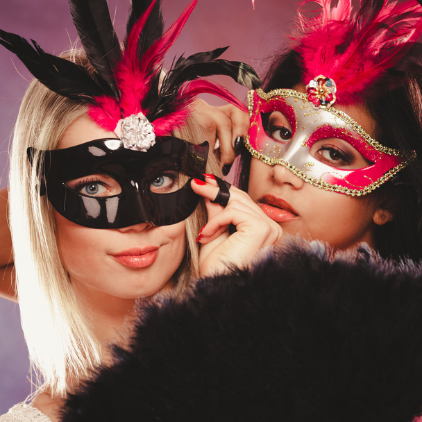 Two women with carnival venetian masks - Photo, image