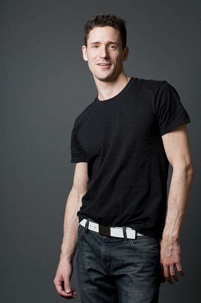 Young handsome guy in black t-shirt. - Fotoğraf, Görsel