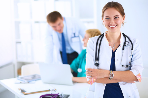 Woman doctor standing with stethoscope at hospital - Valokuva, kuva