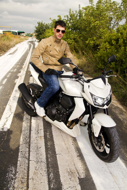 Man with a motorcycle - Φωτογραφία, εικόνα