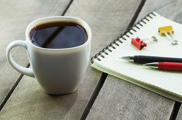 black coffee and notebook on the desktop - 写真・画像