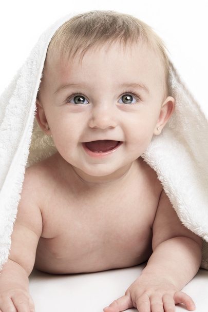 Sweet small baby covered with a towel - 写真・画像